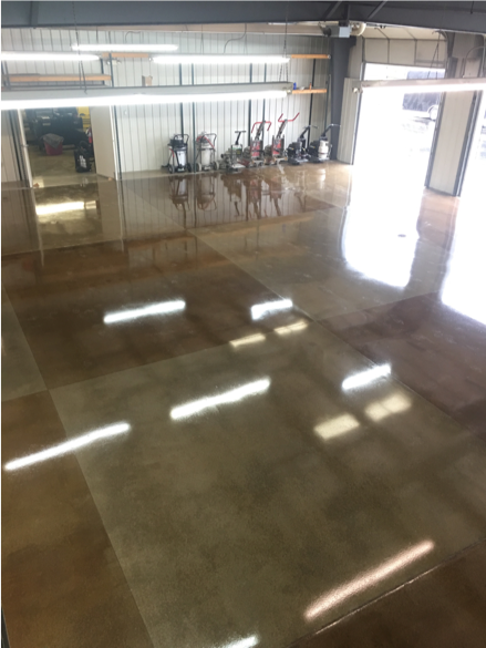 A checkered pattern adorns this polished concrete floor using brown and gray.